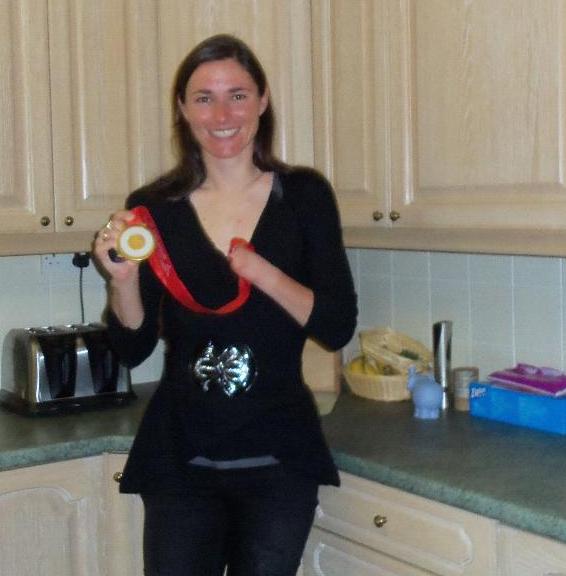 Sarah Storey wearing her paralympic gold medal in the kitchen at cornhills farm